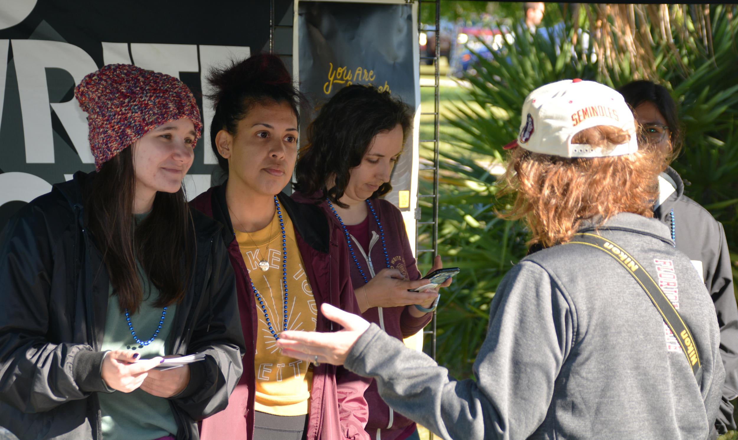 Lara Klopp talking with tablers at To Write Love on Her Arms