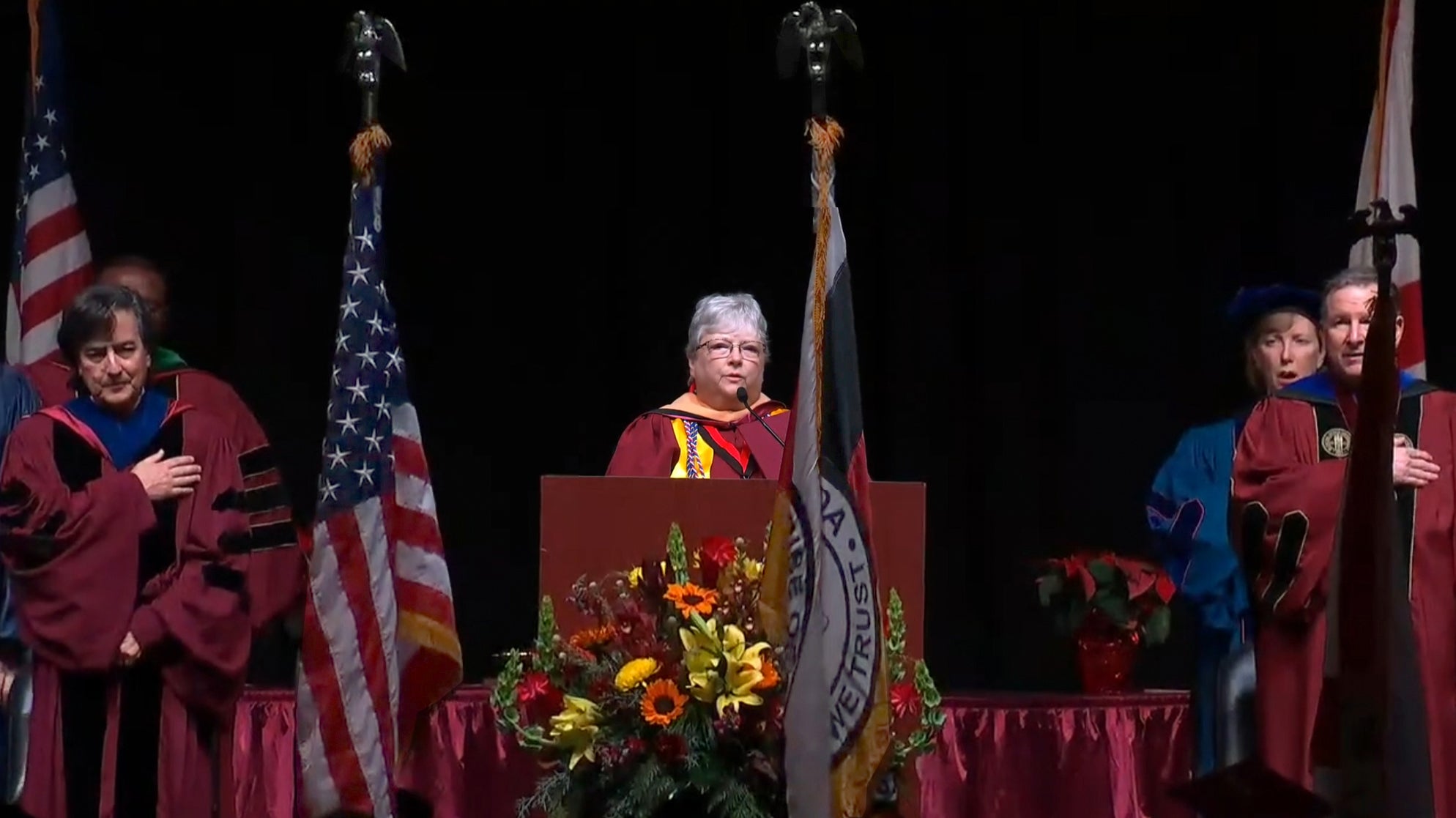 Dawn leading the Pledge of Allegiance at her graduation commencement. 